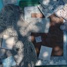 Montage de plaques de lino gravées par Marie Poirier dans des tons bleu, gris et brun.